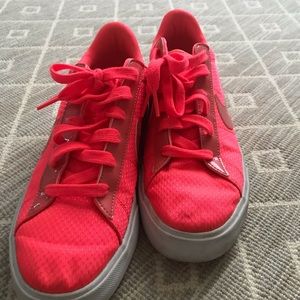 Orange Nike sneakers